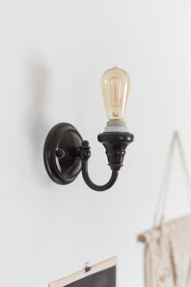 We love Shirock's choice here, to go with an on-trend Edison bulb rather than a shade to pair with this retro sconce. "The older I get, the more minimalist I become," says Shirock. "You just realize there is less and less that you actually need. And that most of the things you need aren't things at all."