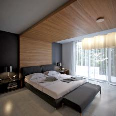 Modern Master Bedroom With Wrap-Around Wood Treatment
