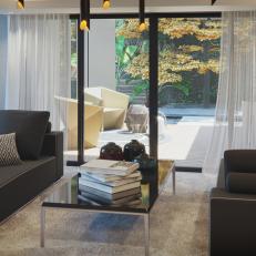 Modern Sitting Room With Charcoal Gray Sofas