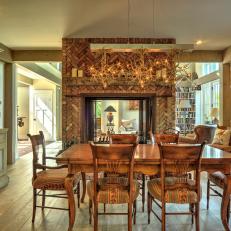 Traditional Rustic Dining Room With Brick Fireplace