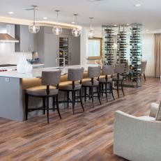Open Plan Gray Kitchen and Wine Wall