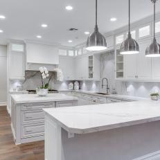 White Chef Kitchen With Industrial Pendant Lights