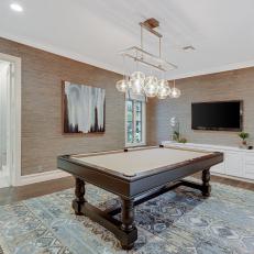 Transitional Neutral Game Room With Blue Rug