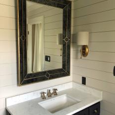 Black Mirror Adds Contrast to Neutral Bathroom While Reflecting Natural Light