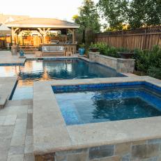Backyard Oasis With Pool and Hot Tub With Stone Accents