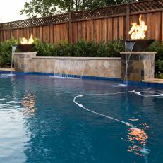 Contemporary Backyard Pool With Waterfall And Fire Pit Columns