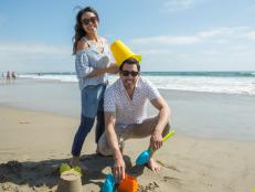 Host Drew Scott and fiancee Linda Phan share a moment in Venice Beach, as seen on Property Brothers at Home: Drew’s Honeymoon House.