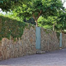 Stone Wall With Green Gates