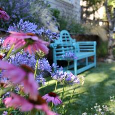 Blue Outdoor Bench and Purple Flowers