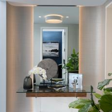 Modern Foyer with Glass Table and Recessed Lighting