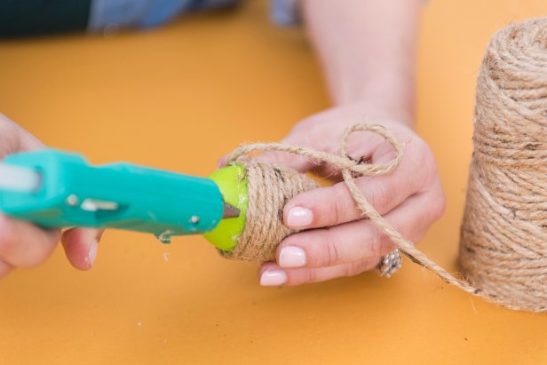 Snap the egg back together when you get near the center, and keep twisting and attaching the twine until you get to the other end.