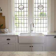 White Victorian Kitchen with White Farmhouse Sink