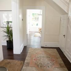 Contemporary White Foyer with Neutral Rug 