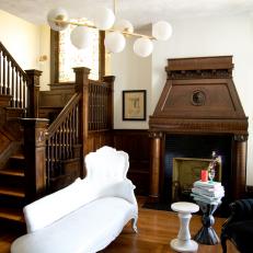 Brown Victorian Foyer with Brown Wood Fireplace Surround