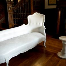 Brown Victorian Foyer with White Chaise
