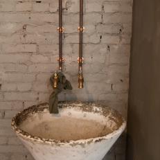 Urban Gray Powder Room with Exposed Copper Pipes
