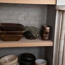 Neutral Wood Shelf in Gray Urban Galley Kitchen 