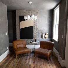 Urban Gray Sitting Room with Brown Leather Armchairs 