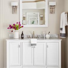 White Vanity With Marble Backsplash Enhances Master Bathroom 