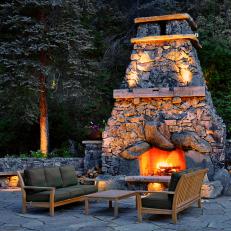 Rustic Stone Outdoor Fireplace and Sofas