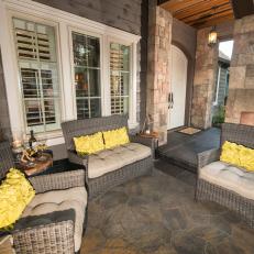 Outdoor Sitting Area With Yellow Pillows
