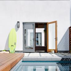 Pool and Green Surfboard