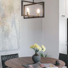 Round Dining Table and Geometric Chandelier