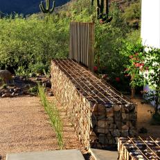 Desert Hardscape with Steel Fins and Stone Gabion Wall 