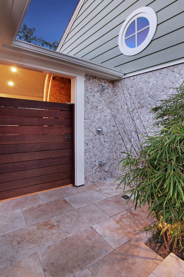 Outdoor Shower With Pebble Backsplash | HGTV
