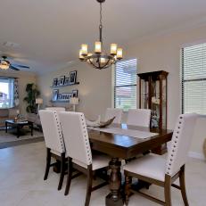 Open Plan Dining Room With White Chairs