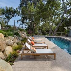 Boulder Retaining Wall and Poolside Patio