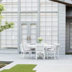 Patio With White Table and Chairs