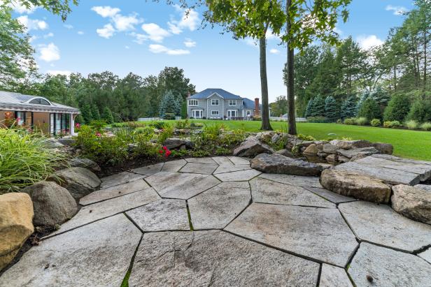 Backyard and Stone Patio | HGTV