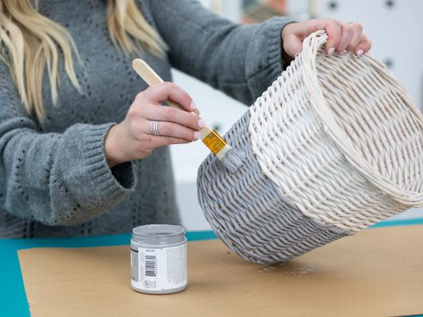 Paint the bottom half of the basket with acrylic paint using a paintbrush, and let dry.