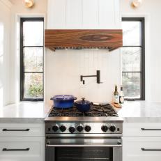 Stainless Steel Oven and White Range Hood