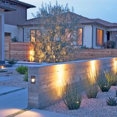 Contemporary Front Yard With Concrete Wall