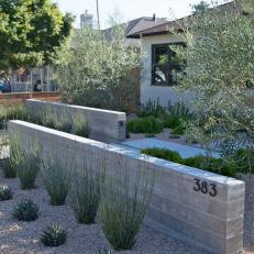 Contemporary Front Yard With Offset Walls