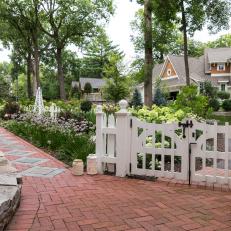 White Cottage Gate and Brick Walkway