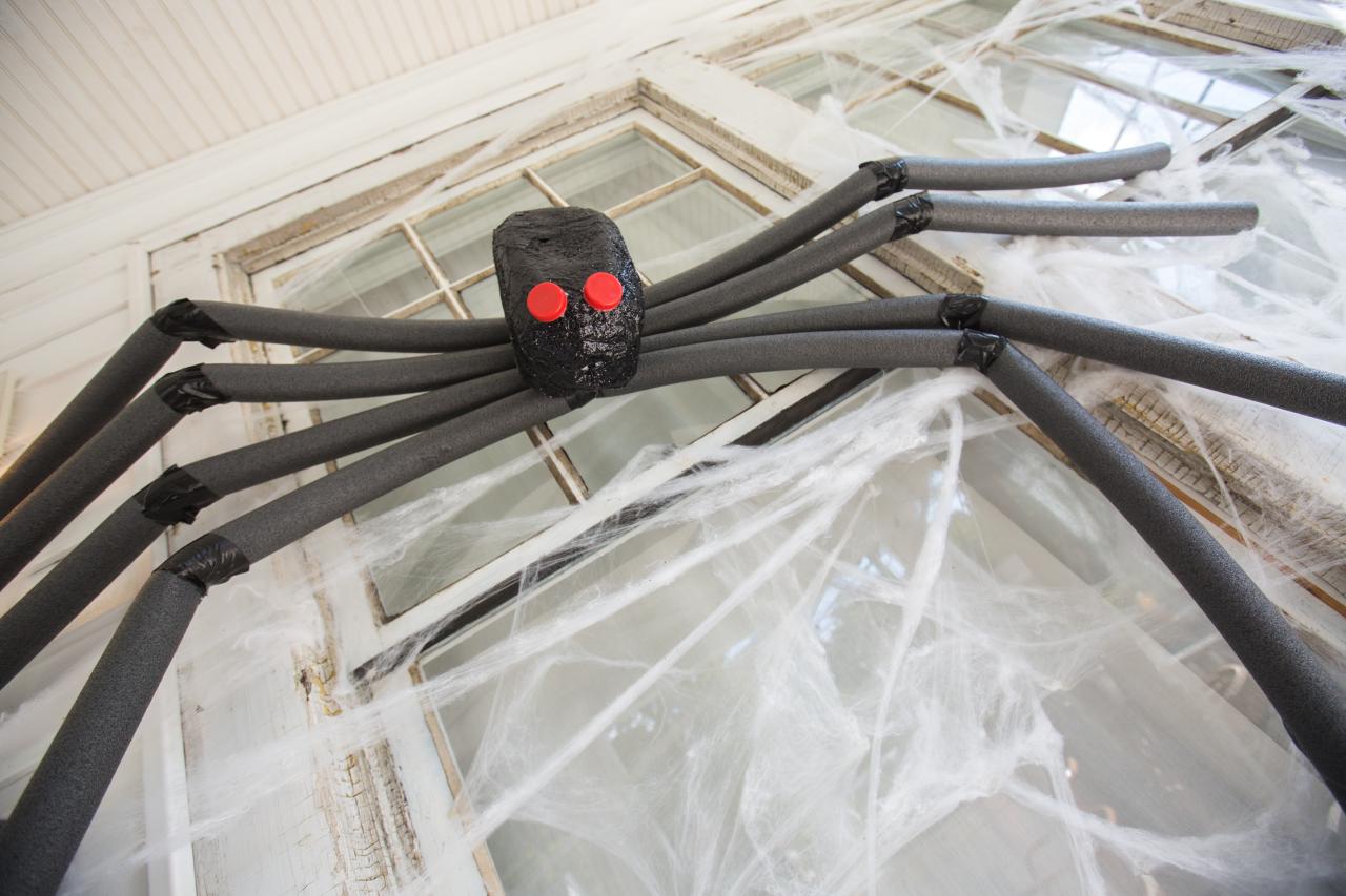 A Giant Spider Decoration Looking Down From A Window Hgtv