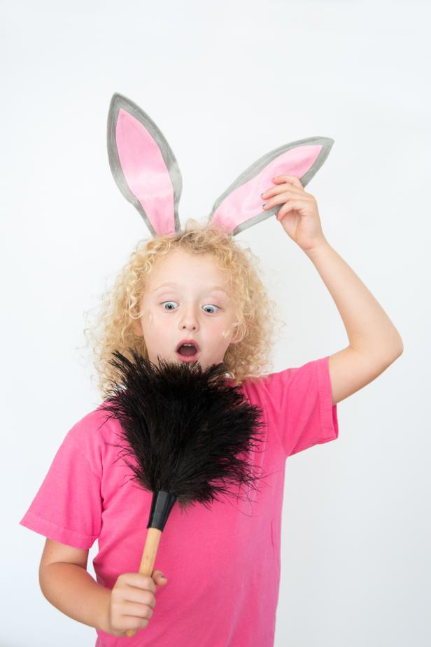 A Dust Bunny Halloween Costume With a Feather Duster