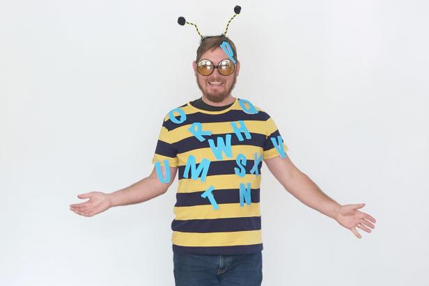 A Spelling Bee Halloween Costume With Letters and Bee Shirt