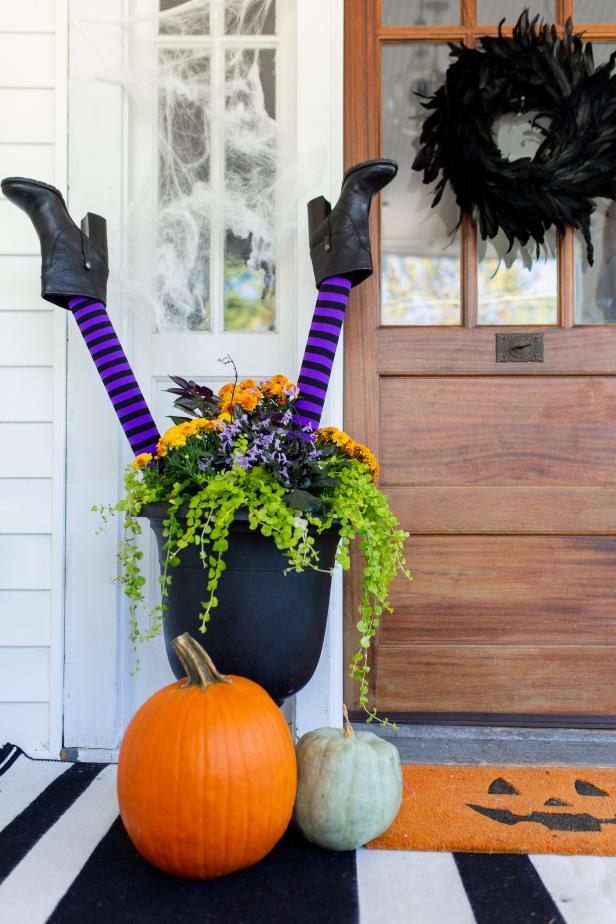 Two Stiff Witches Legs Sticking Out of a Planter