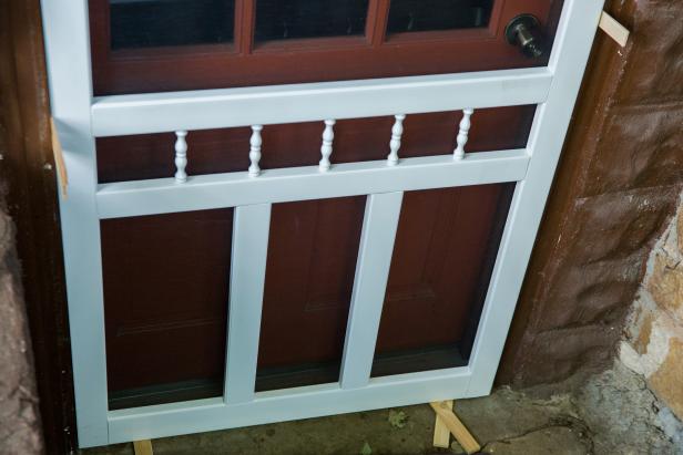 Using shims to hold the door in place, create a 3/16” gap on each side between the screen door and the door jamb.