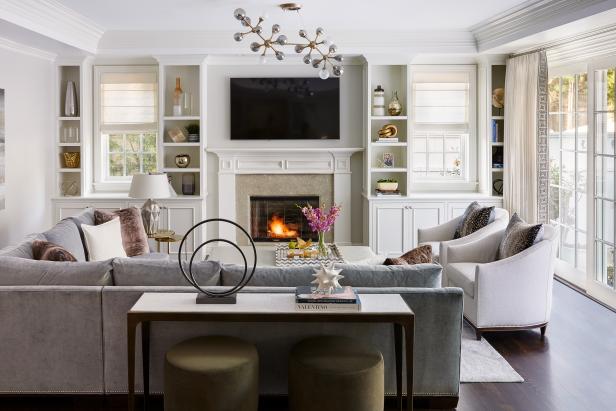 Living Room With Modern Light, Dark Sofa and Symmetrical Built-Ins