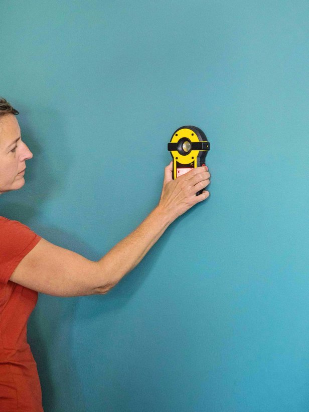 Use a stud finder to locate studs in the wall where you will attach the cleats, and mark with a pencil.
