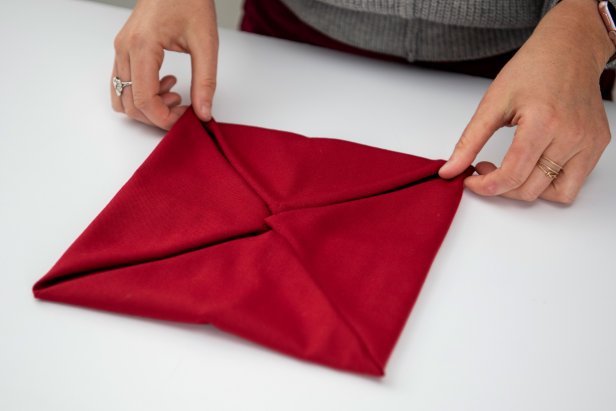Impress your guests this holiday season with a poinsettia napkin.