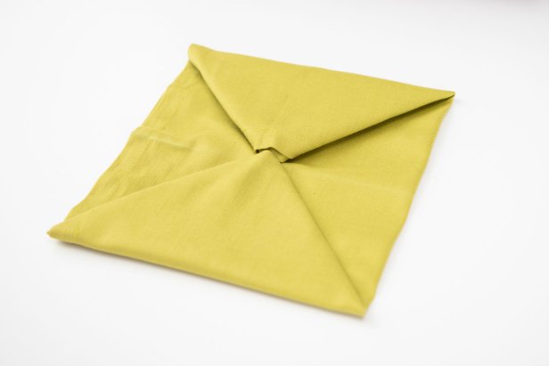 Wow your guests this Christmas with a Christmas tree-shaped napkin.