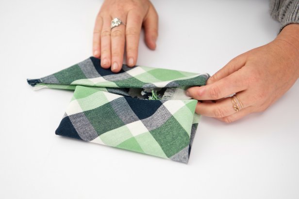 This pinwheel-shaped napkin is sure to impress your guests this holiday season.