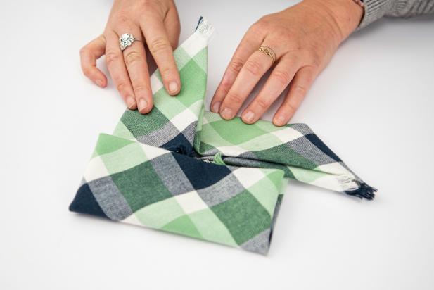 This pinwheel-shaped napkin is sure to impress your guests this holiday season.