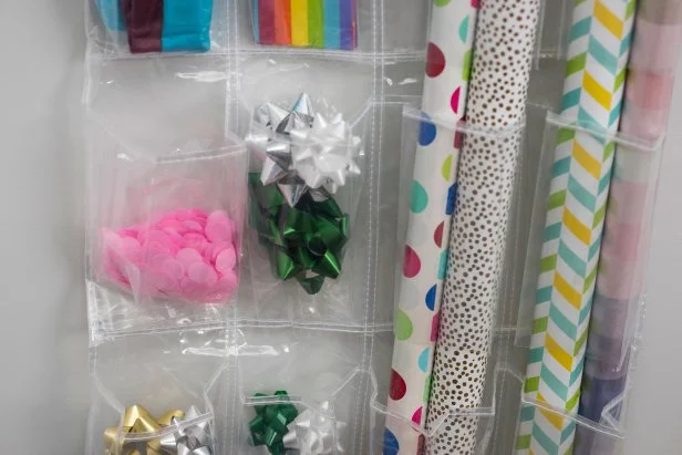 A plastic shoe organizer makes a great hanging organizer for all of your gift wrap supplies.